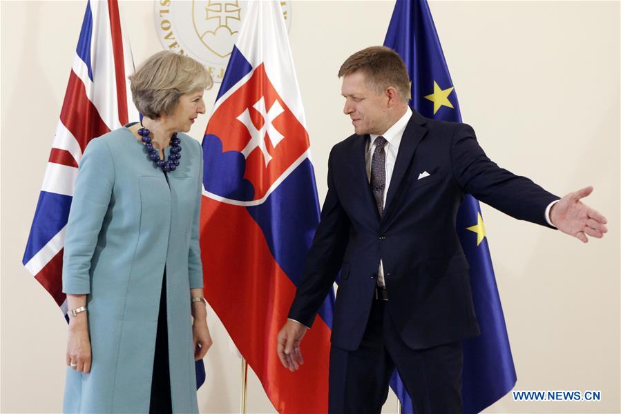 Slovak Prime Minister Robert Fico (R) and his British counterpart Theresa May pose for photography during a joint press conference in Bratislava, Slovakia, on July 28, 2016. 