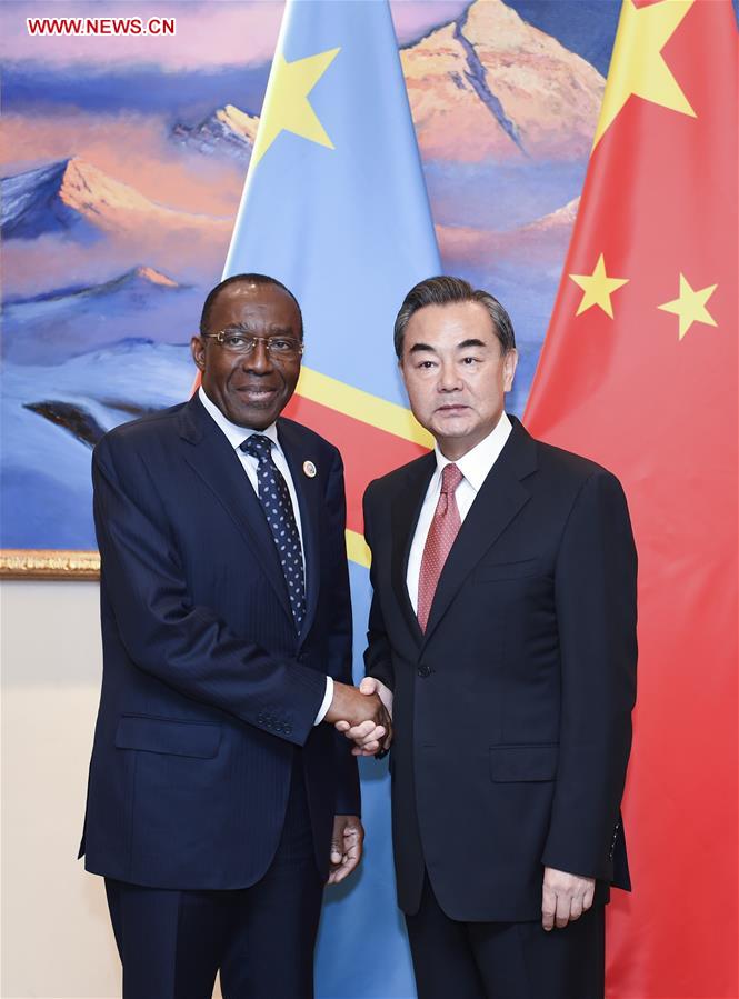 Chinese Foreign Minister Wang Yi (R) meets with DR Congo Foreign Minister Raymond Tshibanda, who came to attend a Sino-African coordinators' meeting on the implementation of actions resulting from the Forum on China-Africa Cooperation (FOCAC) held in Johannesburg of South Africa, in Beijing, capital of China, July 28, 2016. 