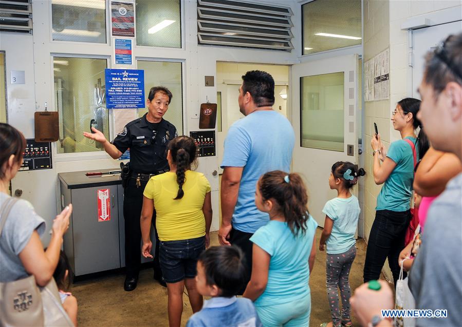 People take part in the 33rd 'National Night Out' program at the Alhambra Police Department in Los Angeles, the United States, Aug. 2, 2016. 