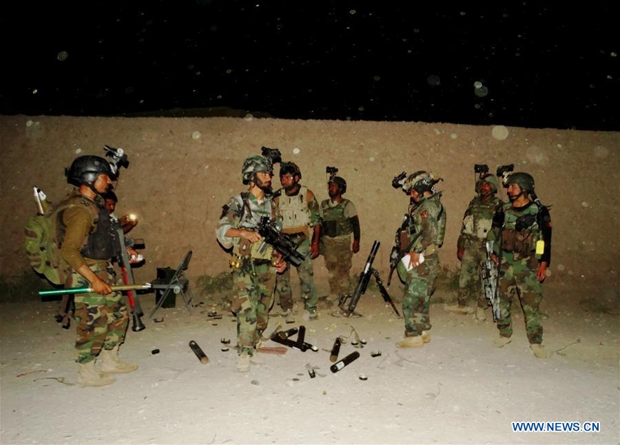 Afghan special force members take part in a night military operation against Taliban in Nad Ali district of Helmand province, Afghanistan, Aug. 2, 2016. 