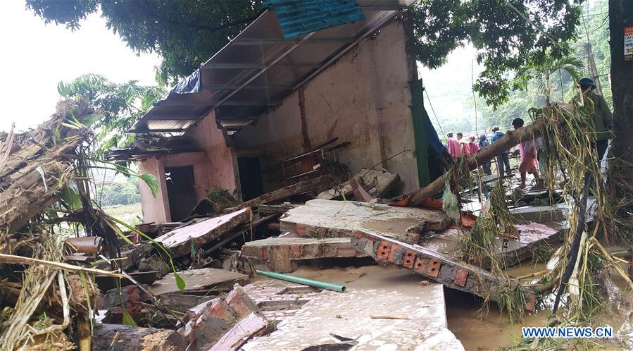 Photo taken on Aug. 5, 2016 shows the collapsed houses in Lao Cai province, northern Vietnam. 
