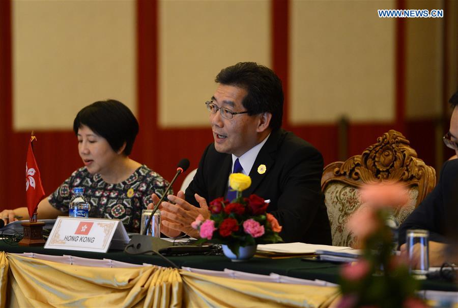 So Kam-leung (R), Secretary for Commerce and Economic Development of China's Hong Kong Special Administrative Region, addresses the 1st ASEAN Economic Ministers-Hong Kong, China Consultations (AEM-HKC Consultations) meeting in Vientiane, Laos, Aug. 6, 2016. 