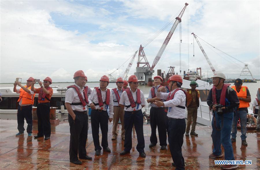 Officials of China Major Bridge Engineering Company Limited visit the construction site of the Padma bridge on the outskirts of Dhaka, capital of Bangladesh, Aug. 9, 2016.