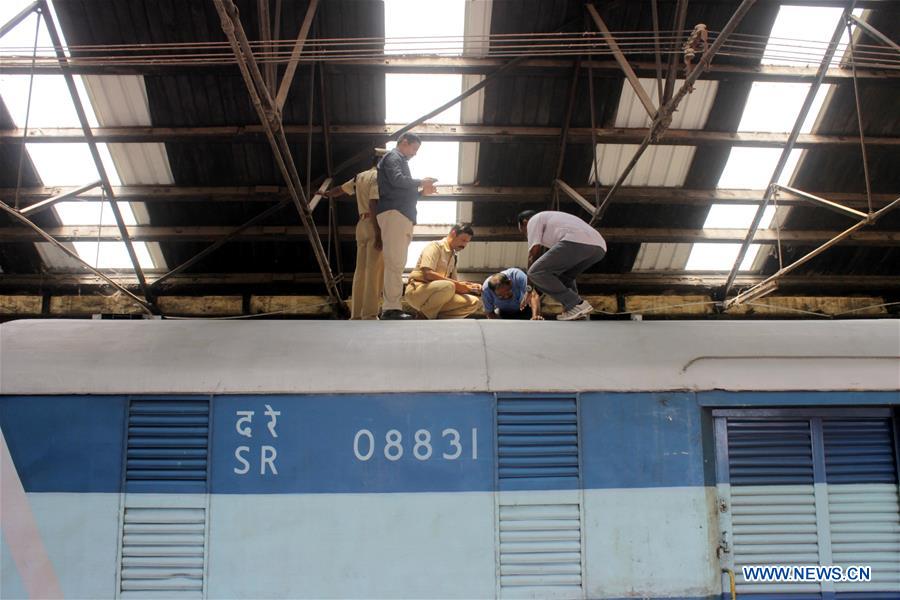 Police inspect a cabin of Salem-Chennai Express train, which was robbed while in transit, at the Egmore Railway Station in Chennai, India, Aug. 10, 2016.