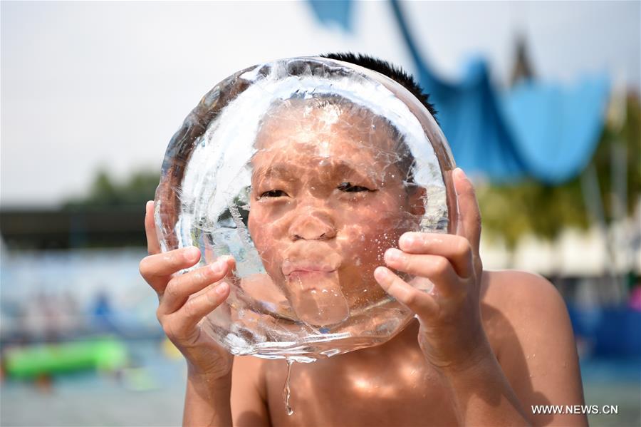 With highest temperature reaching 40 degrees Celsius, local meteorological authorities on Tuesday issued a red alert for high temperatures, urging people to reduce outdoor activities