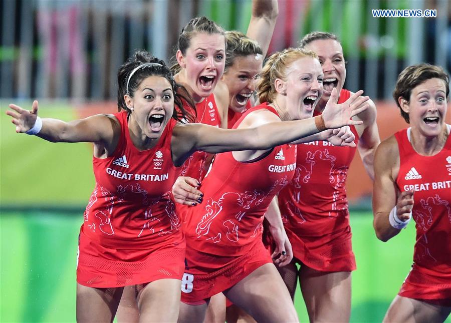 Britain's players celebrate after the women's gold medal match of Hockey at the 2016 Rio Olympic Games in Rio de Janeiro, Brazil, on Aug. 19, 2016. 