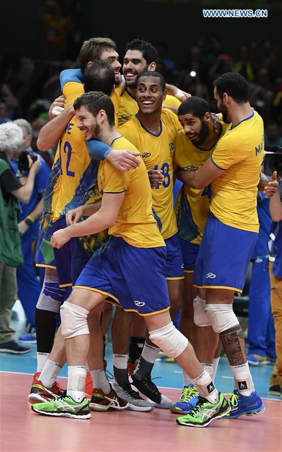 Brazil's players celebrate after the men's semifinal of Volleyball between Brazil and Russia at the 2016 Rio Olympic Games in Rio de Janeiro, Brazil, on Aug. 19, 2016. 