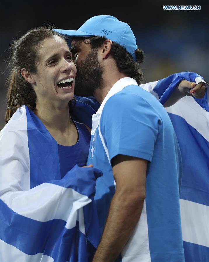 Greece's Ekaterini Stefanidi (L) accepts congratulations after the women's pole vault final of Athletics at the 2016 Rio Olympic Games in Rio de Janeiro, Brazil, on Aug. 19, 2016.