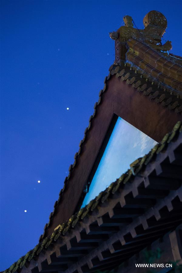 Saturn, Mars and Scorpio star were seen on one straight line Wednesday night. (Xinhua/Su 