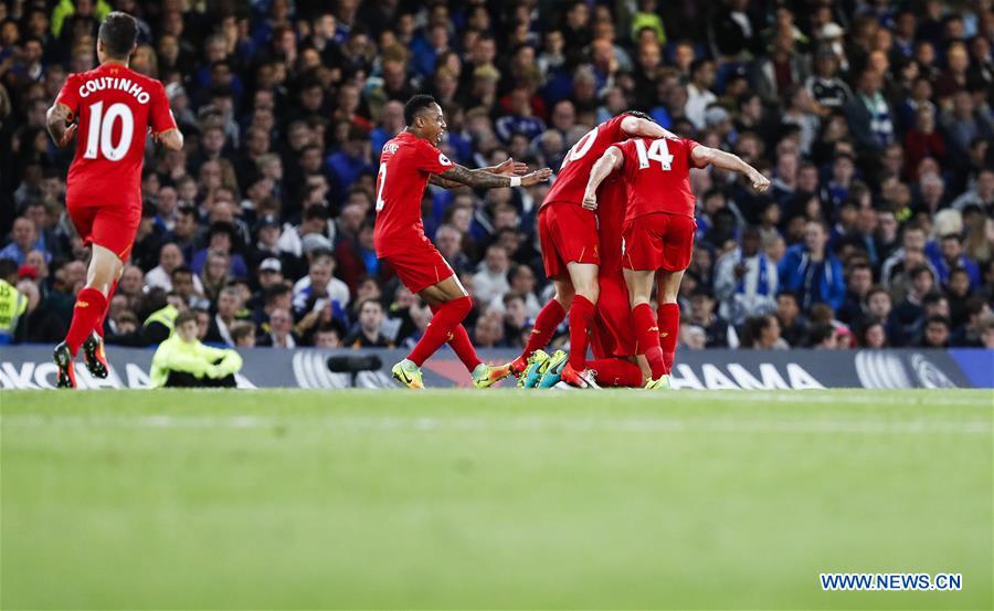 Players of Liverpool celebrate scoring during the English Premier League match between Chelsea and Liverpool in London, Britain, on Sept. 16, 2016. Liverpool won 2-1.