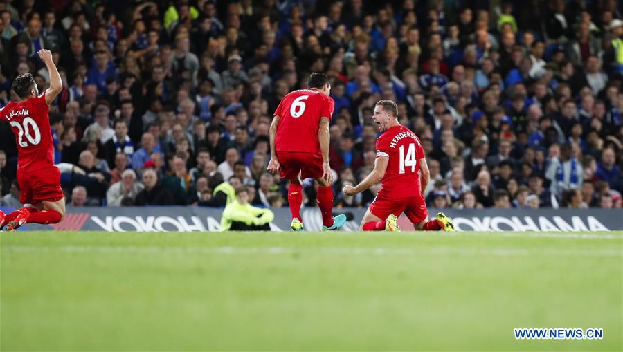 Liverpool's Jordan Henderson (R) celebrates scoring during the English Premier League match between Chelsea and Liverpool in London, Britain, on Sept. 16, 2016. Liverpool won 2-1.