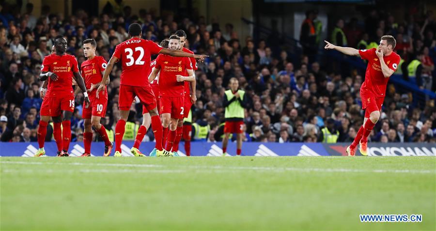 Players of Liverpool celebrate after the English Premier League match between Chelsea and Liverpool in London, Britain, on Sept. 16, 2016. Liverpool won 2-1.