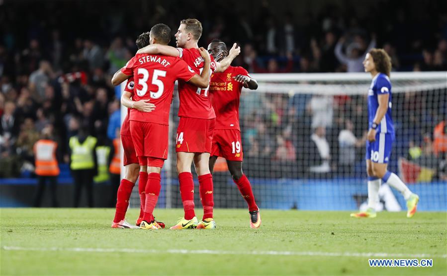 Players of Liverpool celebrate after the English Premier League match between Chelsea and Liverpool in London, Britain, on Sept. 16, 2016. Liverpool won 2-1.