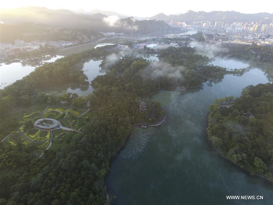 Photo taken on Sept. 20, 2016 shows the fog scenery at the Imperial Mountain Summer Resort in Chengde, north China's Hebei Province. 