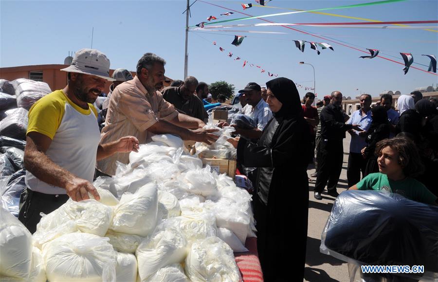 SYRIA-DAMASCUS-AID-DELIVERY-DISPLACED