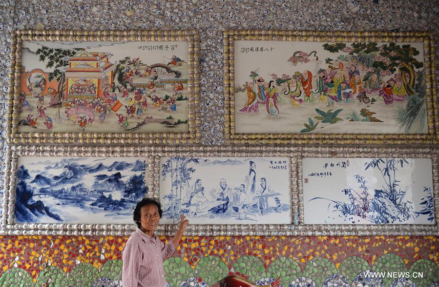 The 86-year-old villager Yu Ermei spent five years to build this porcelain palace. The three-story circular building is decorated with more than 60,000 pieces of porcelain.