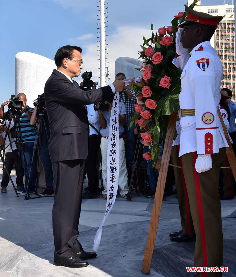 Chinese Premier Li Keqiang lays a wreath to the monument of Jose Marti, a Cuban national hero, in Havana, Cuba, Sept. 24, 2016.