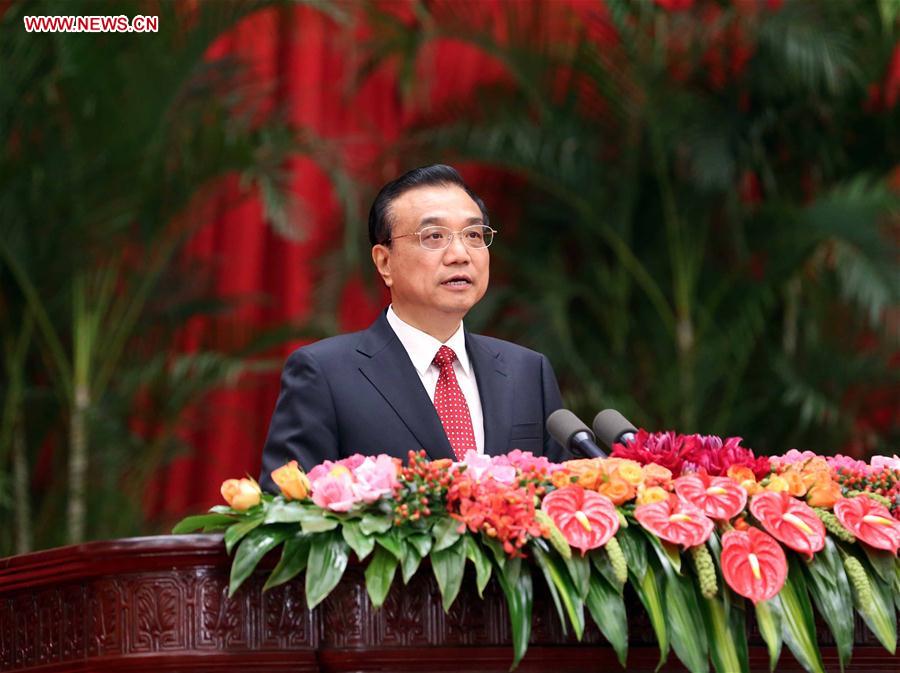 Chinese Premier Li Keqiang addresses a reception held by the State Council to celebrate the 67th anniversary of the founding of the People's Republic of China, in Beijing, capital of China, Sept. 30, 2016. (Xinhua/Liu Weibing) 