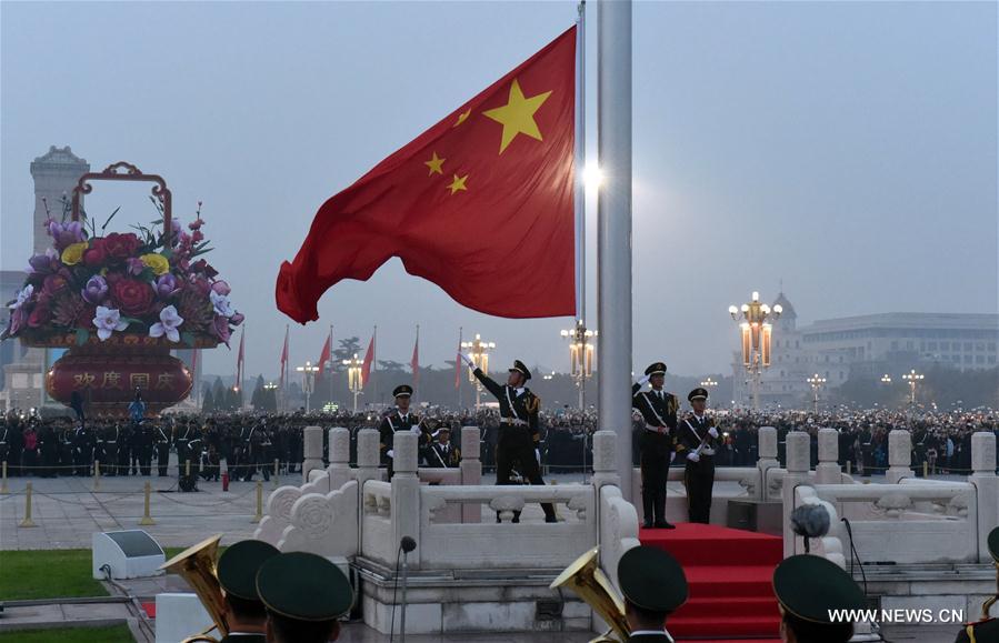 Over 100,000 people from across the country gathered at the Tian'anmen Square to watch the national flag-raising ceremony on the morning of Oct. 1, marking the 67th anniversary of the founding of the People's Republic of China.