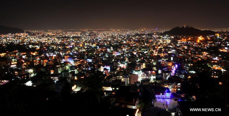 Photo taken on Oct. 30, 2016 shows the Kathmandu Valley glittering with lights during Laxmi Puja, the third day of the Tihar festival, as seen from the hill of Ramkot in Kathmandu, Nepal