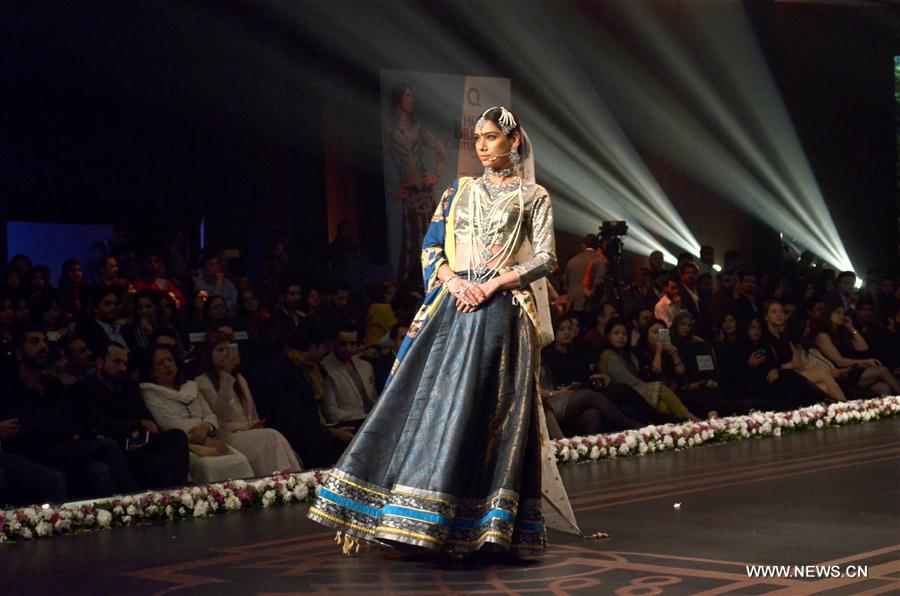 A model presents a creation by designer Anees Malik on the second day of 13th Edition of Bridal Couture Week in eastern Pakistan's Lahore on Nov. 26, 2016.