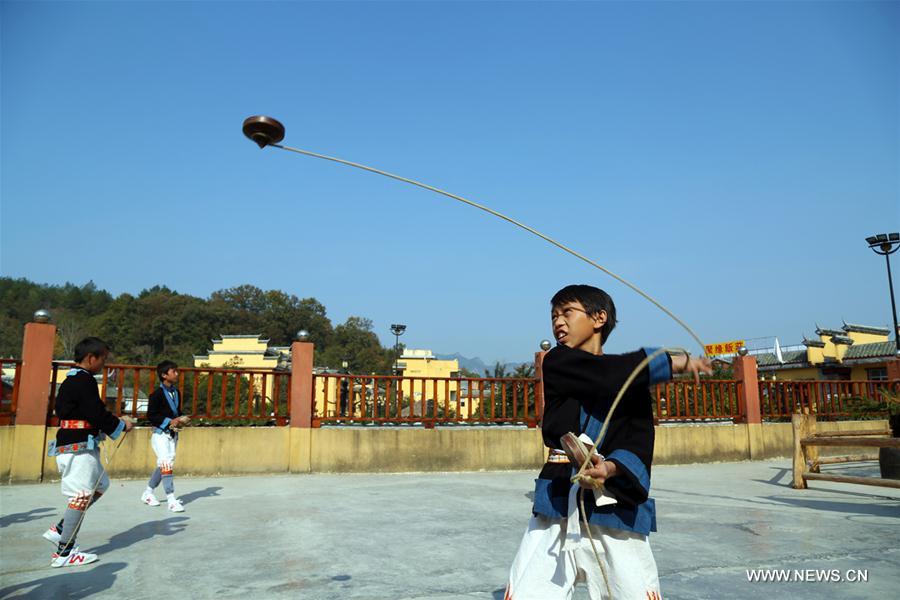 The White Pants Yao, or Baiku Yao in Chinese, is a branch of the Yao ethnic group in southwest China. Playing the whipping top is a popular game for them during festival times.