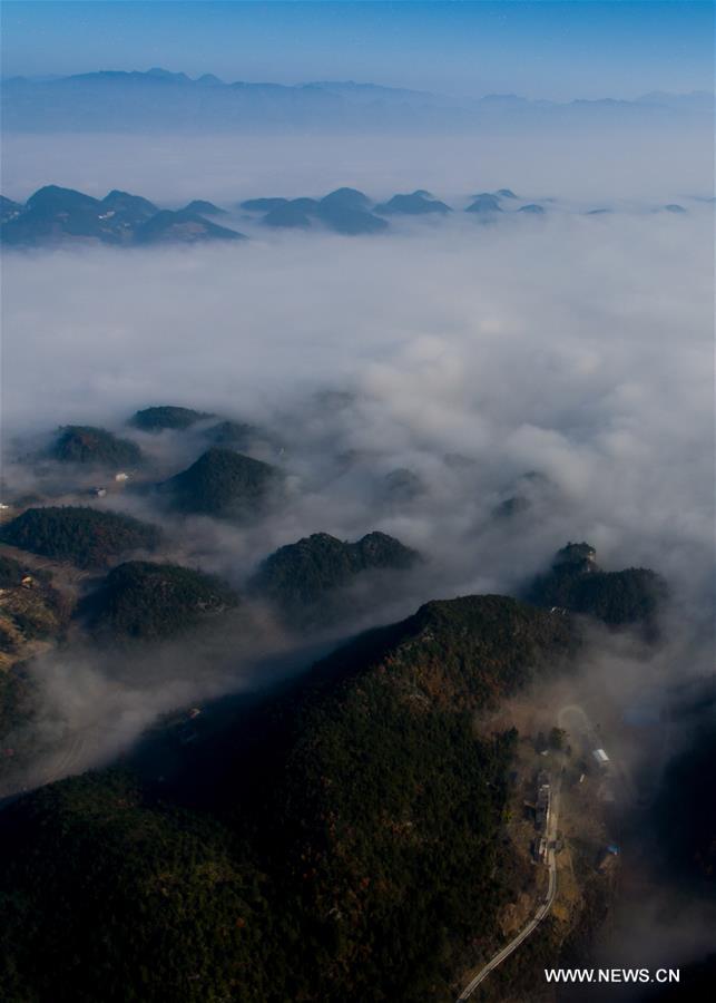 The aerial photo taken on Dec. 9, 2016 shows the sea of clouds scenery in a village of Gulu Town, southwest China's Chongqing. 