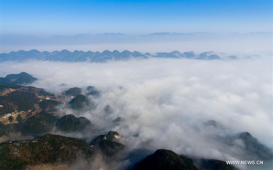 The aerial photo taken on Dec. 9, 2016 shows the sea of clouds scenery in a village of Gulu Town, southwest China's Chongqing. 