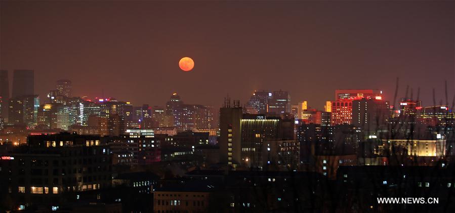 The moon is seen over Beijing, capital of China, Dec. 14, 2016. (Xinhua/Liu Xianguo)