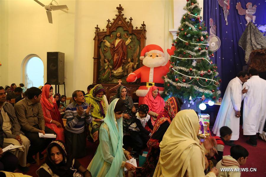 Christians attend a Christmas mass during Christmas celebrations in Rawalpindi, Pakistan, Dec. 25, 2016. 