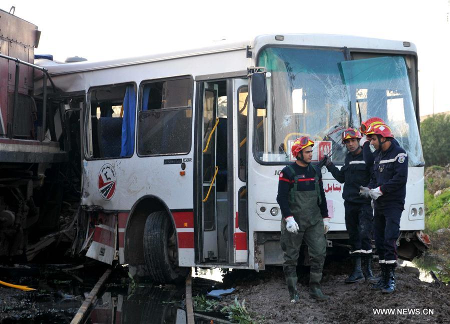 At least five people were killed and more than 40 injured on Wednesday when a train slammed into a public bus before dawn near Tunis