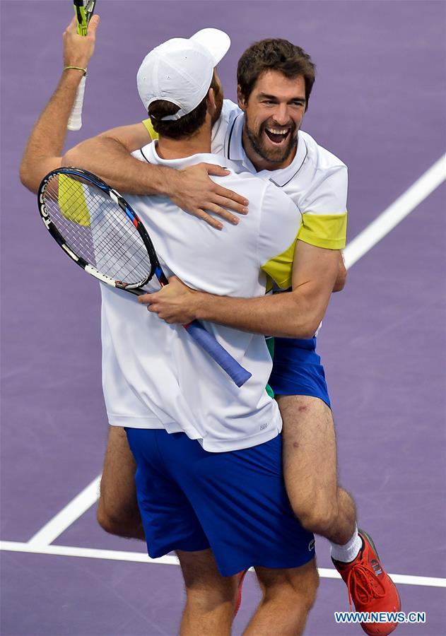 Jeremy Chardy (R) of France celebrates with his partner and compatriot Fabrice Martin after winning the ATP Qatar Open tennis tournament doubles final match against Vasek Pospisil of Canada and Radek Stepanek of the Czech Republic at the Khalifa International Tennis Complex in Doha, capital of Qatar on Jan. 6, 2017. Jeremy Chardy and Fabrice Martin claimed the title with 2-0. (Xinhua/Nikku) 