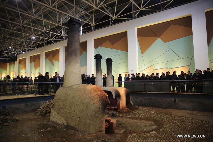 Tourists visit the Ruguanyao kiln site in Qingliangsi Village of Baofeng County, central China's Henan Province, Jan. 16, 2017. 
