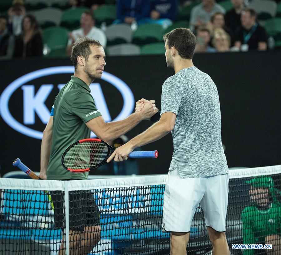 Grigor Dimitrov (R) of Bulgaria shakes hands with Richard Gasquet of France after the men's singles third round match at the Australian Open Tennis Championships in Melbourne, Australia, Jan. 21, 2017. Dimitrov won 3-0. (Xinhua/Zhu Hongye)
