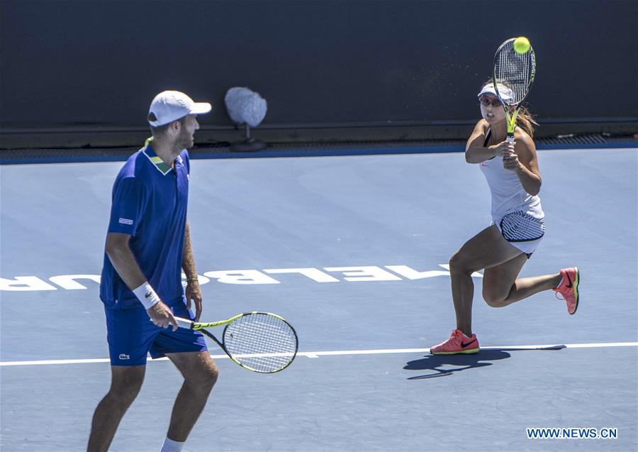 Xu Yifan (R) of China and Fabrice Martin of France compete during the mixed doubles first round match against Liezel Huber of the U.S. and Marcin Matkowski of Poland at the Australian Open Tennis Championships in Melbourne, Australia, Jan. 22, 2017. Xu Yifan and Fabrice Martin won 2-0. (Xinhua/Lui Siu Wai)