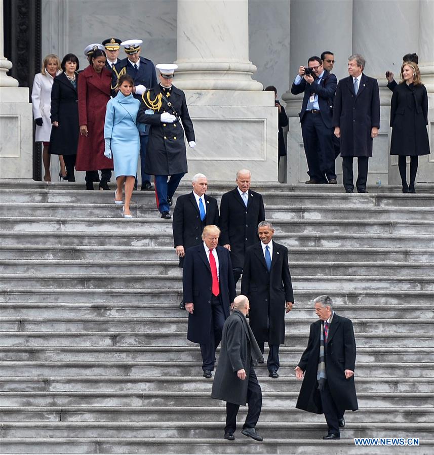 Former U.S. President Barack Obama(R, second row) and newly-inaugurated U.S. President Donald Trump(L, second row) walk down the steps of U.S. Capitol prior to Obama's departure after Donald Trump was sworn in as the 45th President of the United States in Washington D.C., the United States, on Jan. 20, 2017. (Xinhua/Bao Dandan) 