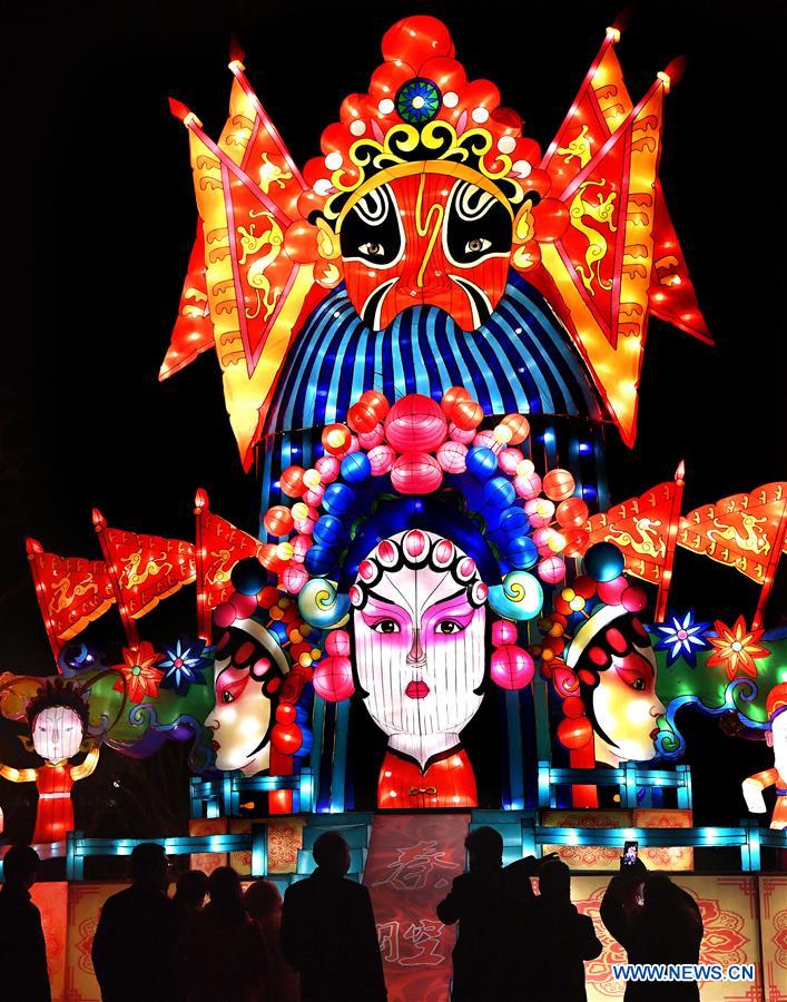 Visitors view lanterns during an international light art festival in Hancheng, northwest China's Shaanxi Province, Jan. 20, 2017. The light festival, themed on the Belt and Road Initiative, kicked off here on Saturday, displaying over 500 sets of light works. (Xinhua/Tao Ming) 