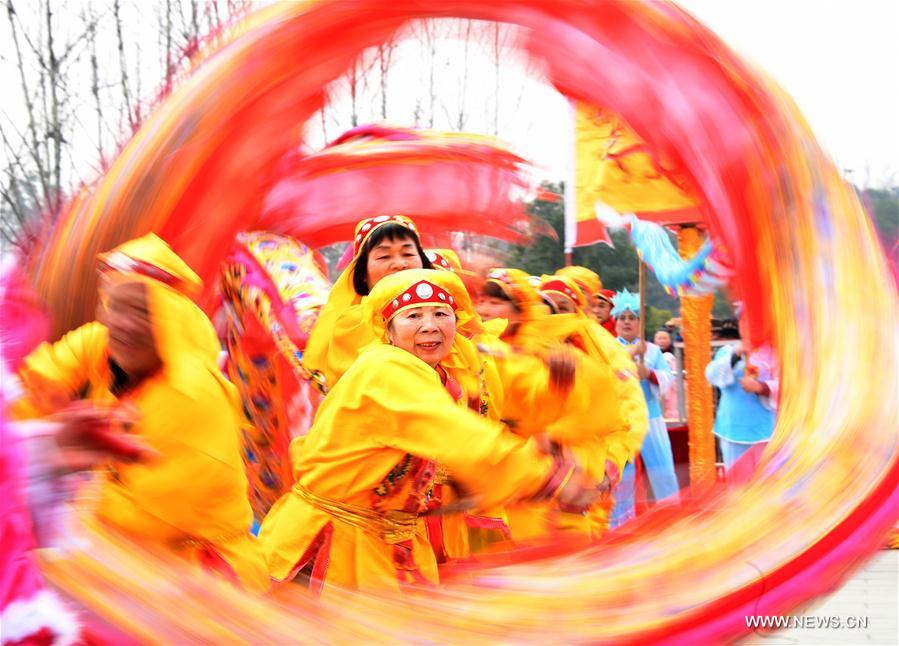 Participants perform dragon dance during a contest in Wuhan, capital of central China's Hubei Province, Jan. 31, 2017. 