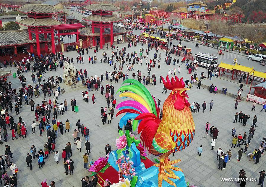 Tourists visit a temple fair in Kaifeng, central China's Henan Province, Jan. 31, 2017.