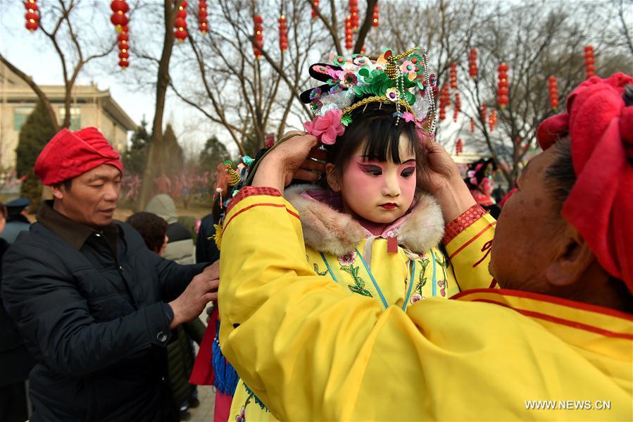 A young girl prepares to perform at a temple fair in Taiyuan, capital of north China's Shanxi Province, Feb. 3, 2017, the 7th day of the Chinese Lunar New Year. (Xinhua/Zhan Yan) 