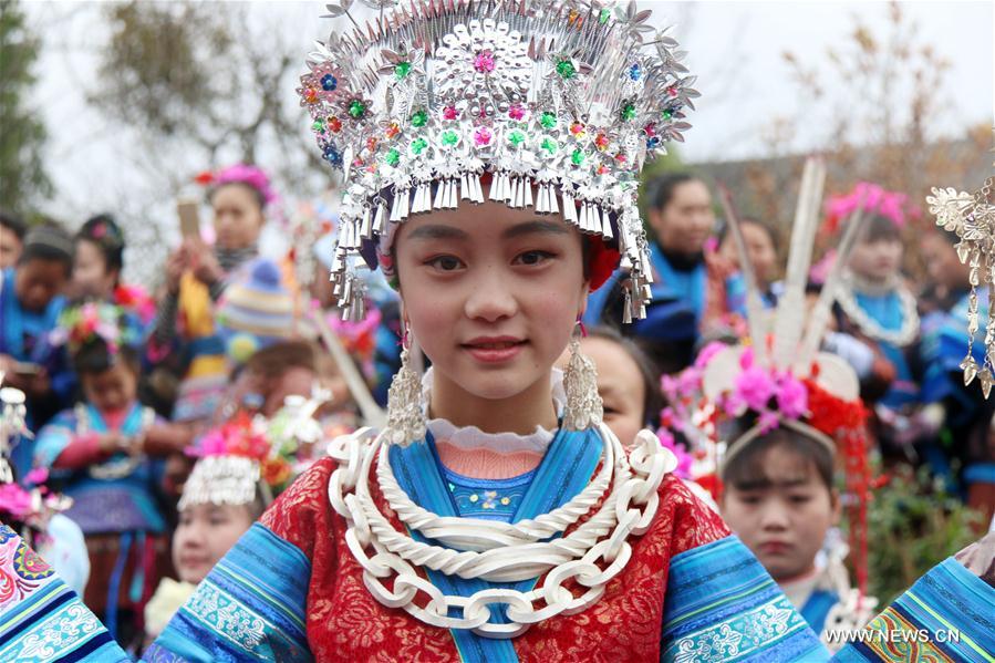 People of Miao ethnic group take part in 'Ganpingzi,' a 200-year-old folk event held on the 7th day of a lunar new year's first month, to pray for a good fortune in Gaoqing Miao Village of Diping Township of Liping County, southwest China's Guizhou Province, Feb. 3, 2017.