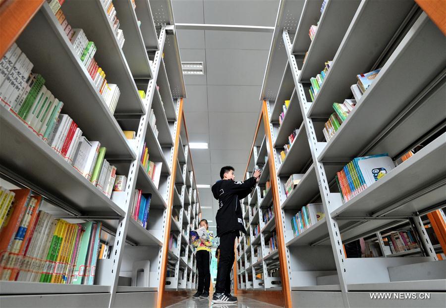 Students read books at Cangzhou Library during winter vacation in Cangzhou City, north China's Hebei Province, Feb. 4, 2017.