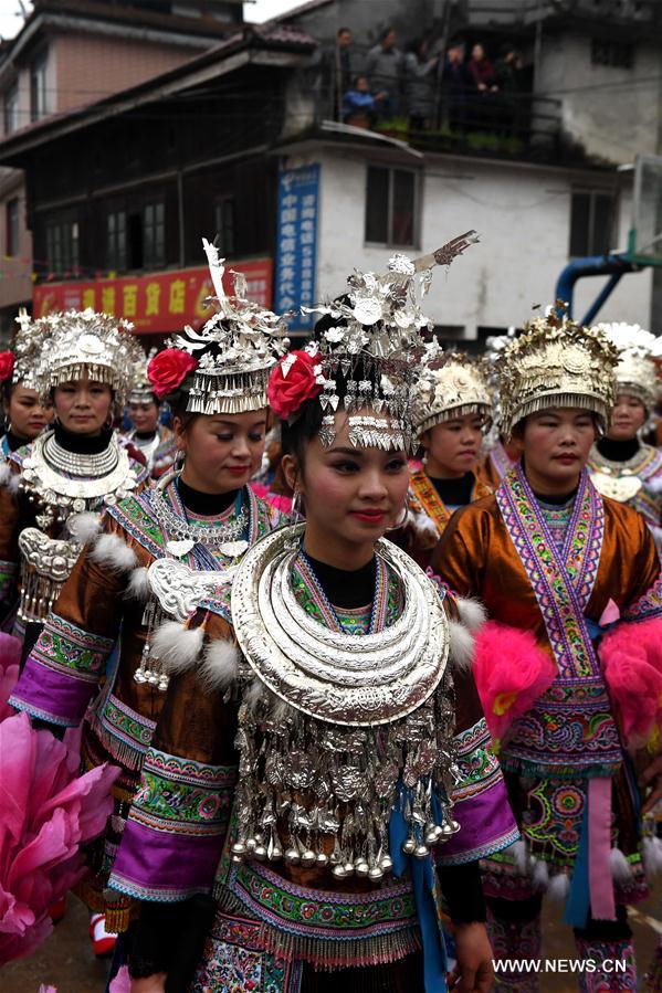 People of Miao ethnic group dance during a gathering to strengthen friendship and to celebrate the Spring Festival, or the Chinese Lunar New Year, at Lindong Village in Rongshui Miao Autonomous County, south China's Guangxi Zhuang Autonomous Region, Feb. 7, 2017
