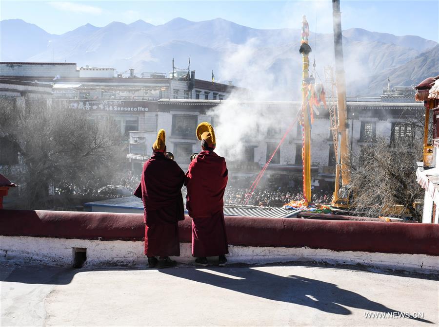 As the Tibetan New Year draws near, prayer flags tied on the five poles surrounding the Jokhang Temple have been replaced by new ones in accordance with Tibetan tradition. 