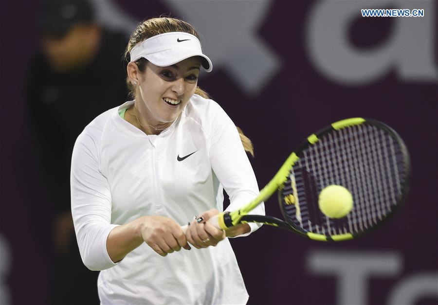 Catherine Bellis of United States returns the ball during the women's singles 2nd round qualifying match against Zheng Saisai of China at WTA Qatar Open 2017 at the International Khalifa Tennis Complex of Doha, Qatar, Feb. 12, 2017. 