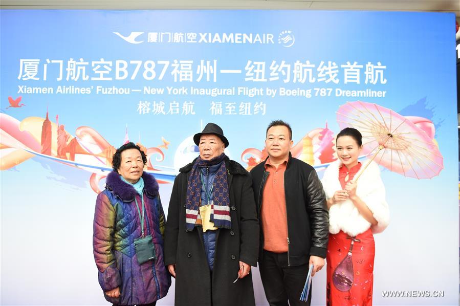 Passengers of MF849 pose for photos at the Fuzhou International Airport in Fuzhou, capital of southeast China's Fujian Province, Feb. 15, 2017. MF849, the first direct flight of Xiamen Airlines from Fuzhou to New York, took off here on Wednesday. (Xinhua/Lin Shanchuan)