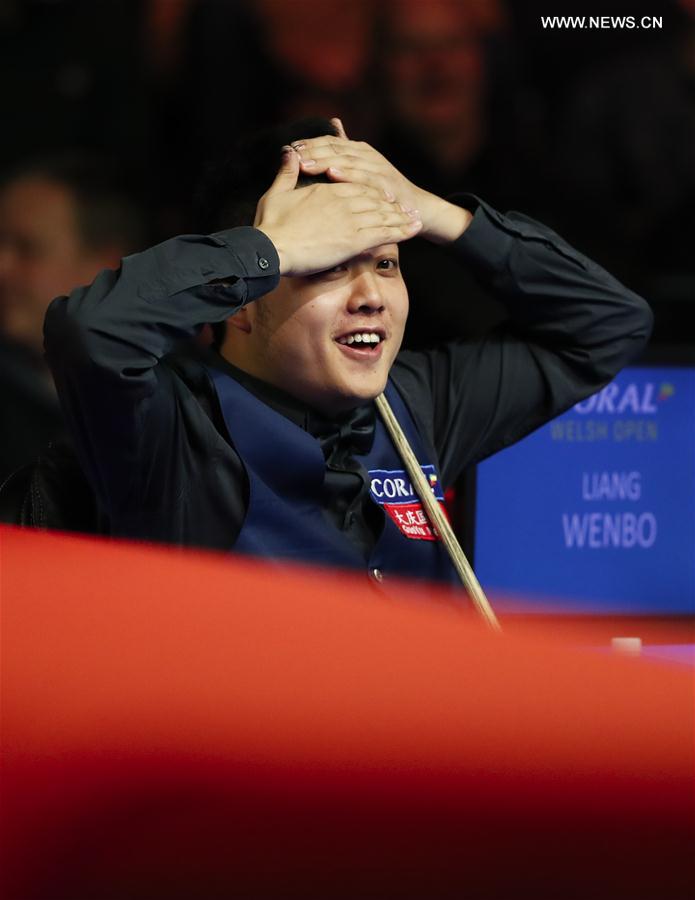 Liang Wenbo of China reacts during the second round match against Michael White of Wales at Welsh Open 2017 in Cardiff, Wales, Britain on Feb. 15, 2017. 