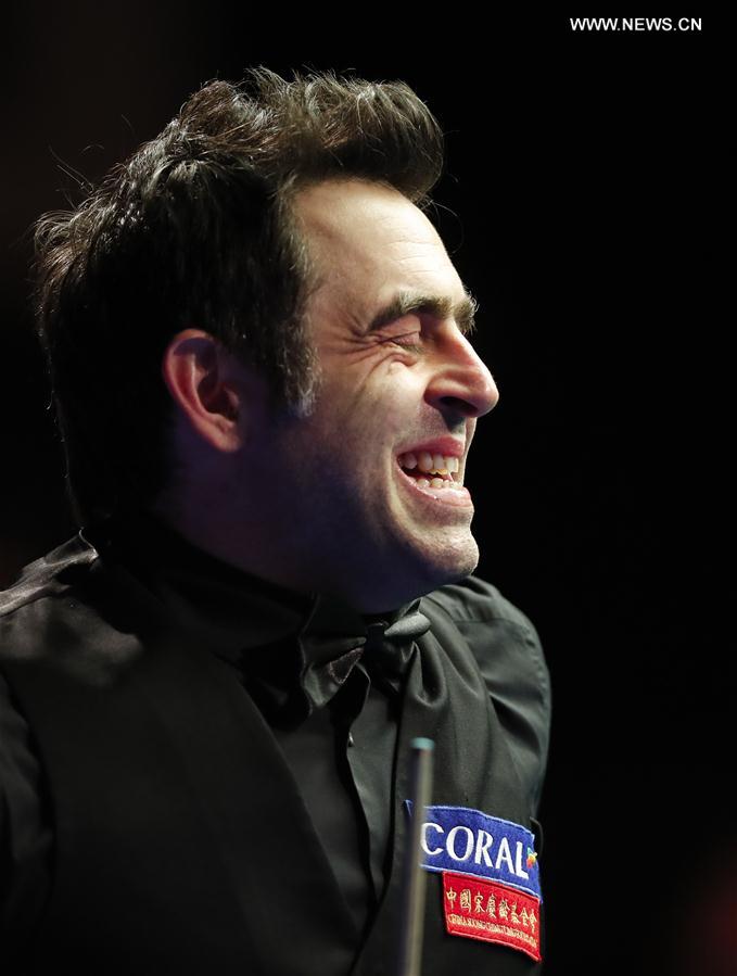 Ronnie O'Sullivan of England reacts during the second round match against Mark Davis of England at Welsh Open 2017 in Cardiff, Wales, Britain on Feb. 15, 2017. 