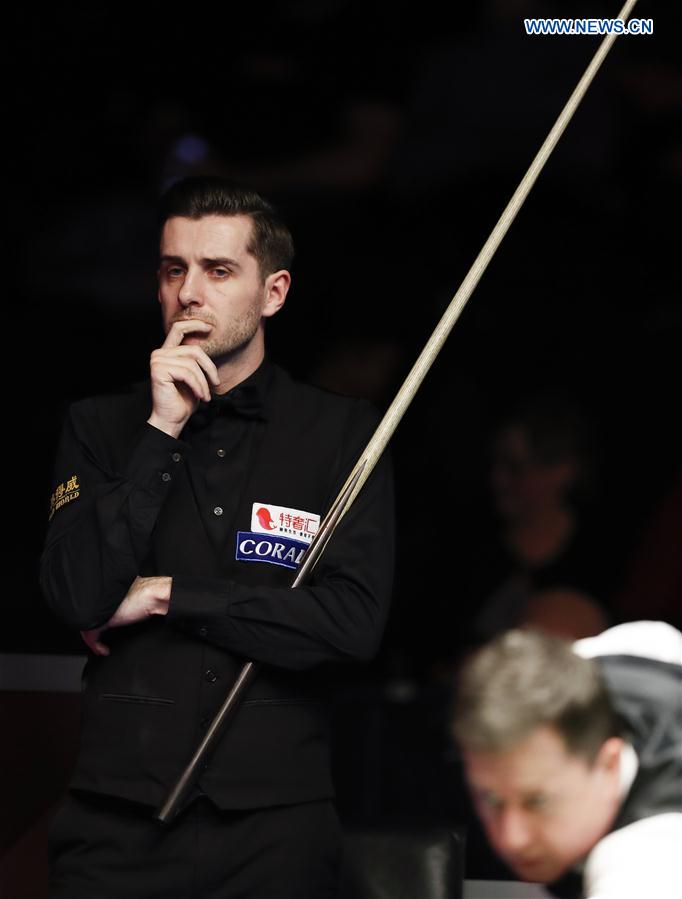 Mark Selby of England reacts during the second round match against Mike Dunn of England at Welsh Open 2017 in Cardiff, Wales, Britain on Feb. 15, 2017.