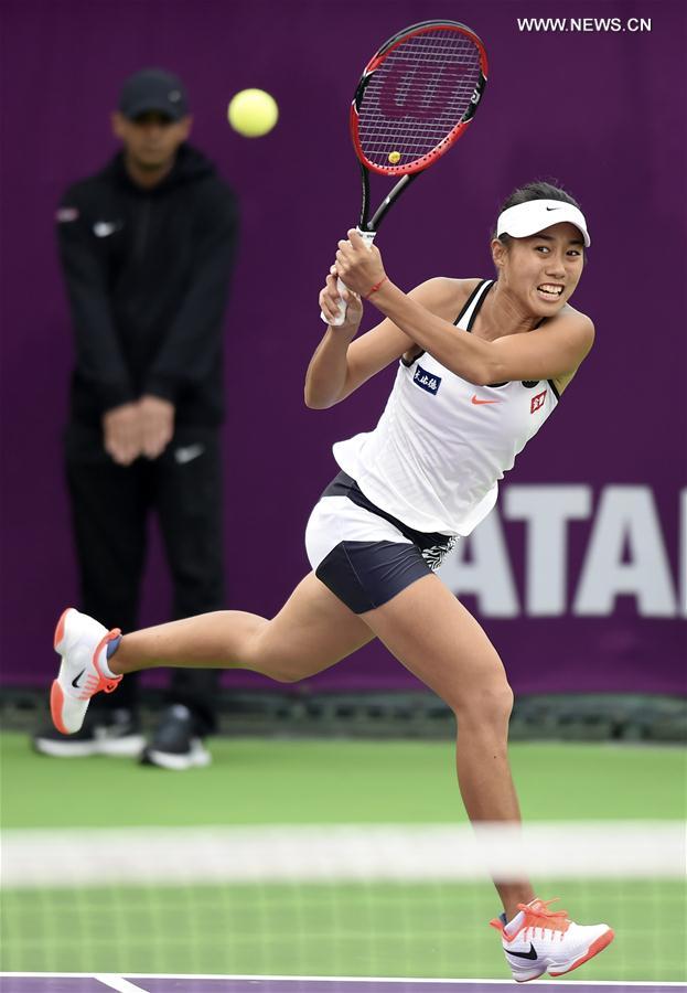 Zhang Shuai of China returns the ball during the singles second round match against Garbine Muguruza of Spain at WTA Qatar Open 2017 at the International Khalifa Tennis Complex of Doha, Qatar, Feb. 15, 2017. 